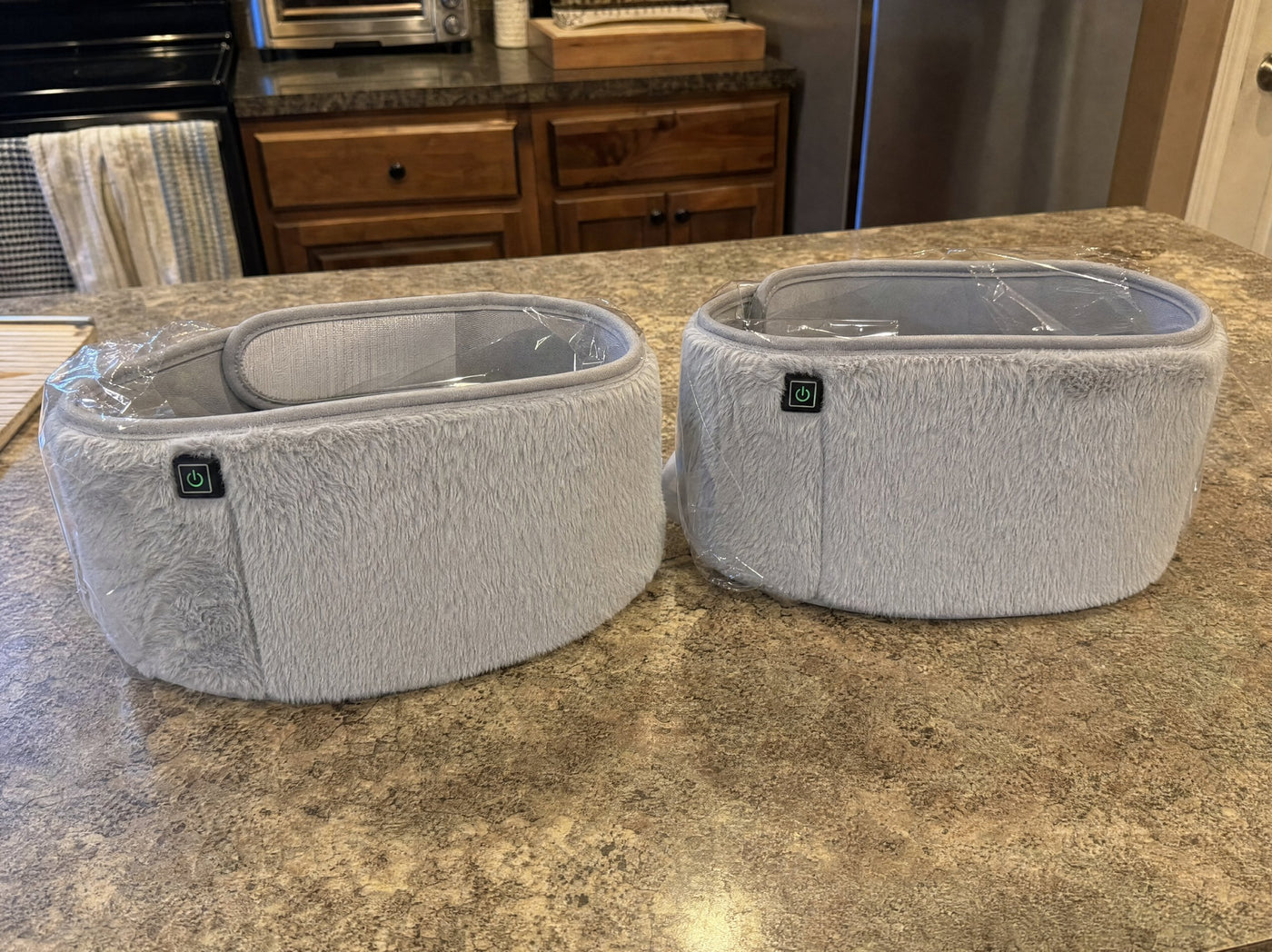 A customer photo of two FuzzyPouches on a kitchen counter